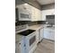 Bright kitchen with stainless steel appliances and new vinyl flooring at 2005 Greens Blvd. # D301, Myrtle Beach, SC 29577