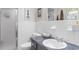 Simple, yet clean bathroom with white tile walls, a walk-in shower, and a single sink vanity at 207 Green Lake Dr., Myrtle Beach, SC 29572