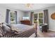 Serene bedroom featuring a decorative bed frame, large windows, and calming color palette at 207 Green Lake Dr., Myrtle Beach, SC 29572