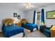 Charming bedroom with twin beds, floral accents, and soothing blue tones at 207 Green Lake Dr., Myrtle Beach, SC 29572