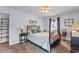 Comfortable bedroom features a metal bed frame, carpet flooring, a ceiling fan, and natural light at 207 Green Lake Dr., Myrtle Beach, SC 29572