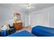 Cozy bedroom featuring two twin beds, a ceiling fan, closet, and a classic dresser with nautical themed decor at 207 Green Lake Dr., Myrtle Beach, SC 29572
