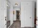 Inviting entryway with white doors, mirrored wall, carpeted floor and recessed lighting at 207 Green Lake Dr., Myrtle Beach, SC 29572