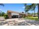 Side view of brick house with a two-car garage, open for parking at 207 Green Lake Dr., Myrtle Beach, SC 29572