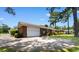 Brick house with a two-car garage and long driveway at 207 Green Lake Dr., Myrtle Beach, SC 29572