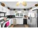 Well-lit kitchen featuring modern appliances, granite countertops, and decorative window treatment at 207 Green Lake Dr., Myrtle Beach, SC 29572
