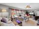 Cozy living room with plush sofas, neutral tones, and ample natural light at 207 Green Lake Dr., Myrtle Beach, SC 29572