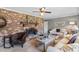 Comfortable living room with a brick fireplace, ceiling fan, and inviting furniture at 207 Green Lake Dr., Myrtle Beach, SC 29572