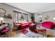 Bright living room showcasing a large window, hardwood floors, and modern decor at 207 Green Lake Dr., Myrtle Beach, SC 29572