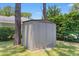Durable metal storage shed in a fenced backyard offers space for organizing outdoor equipment and tools at 207 Green Lake Dr., Myrtle Beach, SC 29572