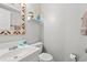 Small bathroom with decorative mirror, white vanity, and white toilet at 208 N Ocean Blvd. # 226, North Myrtle Beach, SC 29582