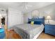 Comfortable bedroom with hardwood floors, a ceiling fan, and beach-themed décor at 208 N Ocean Blvd. # 226, North Myrtle Beach, SC 29582
