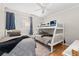 Bright bedroom featuring a twin-over-twin bunk bed and a separate twin bed at 208 N Ocean Blvd. # 226, North Myrtle Beach, SC 29582