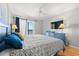 Comfortable bedroom with a ceiling fan, TV, dresser, and ocean views at 208 N Ocean Blvd. # 226, North Myrtle Beach, SC 29582