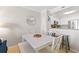 Bright dining area with white table, seating for four, and adjacent kitchen access at 208 N Ocean Blvd. # 226, North Myrtle Beach, SC 29582