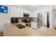 Well-equipped kitchen featuring stainless steel appliances, white cabinets, and ample counter space at 208 N Ocean Blvd. # 226, North Myrtle Beach, SC 29582