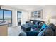 Cozy living room with balcony access offering ocean views and comfortable blue furnishings at 208 N Ocean Blvd. # 226, North Myrtle Beach, SC 29582