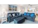 Living room with comfortable seating, beach-themed décor, and a partial view of the kitchen at 208 N Ocean Blvd. # 226, North Myrtle Beach, SC 29582