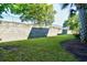 Lush backyard featuring a well-maintained lawn, mature trees, and a secure privacy wall at 2180 Waterview Dr. # 1013, North Myrtle Beach, SC 29582