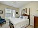 Comfortable bedroom featuring a large window for natural light and a quaint four-poster bed at 2180 Waterview Dr. # 1013, North Myrtle Beach, SC 29582