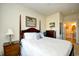 Well-lit bedroom features a charming four poster bed and access to the en-suite bathroom at 2180 Waterview Dr. # 1013, North Myrtle Beach, SC 29582