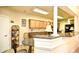Eat-in kitchen featuring granite countertops, wood cabinets, and neutral tile floors at 2180 Waterview Dr. # 1013, North Myrtle Beach, SC 29582