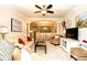 Spacious living room with ceiling fan, comfortable seating, and open access to dining and kitchen at 2180 Waterview Dr. # 1013, North Myrtle Beach, SC 29582