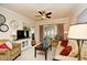 Inviting living room with a ceiling fan, plenty of seating, and a sliding glass door at 2180 Waterview Dr. # 1013, North Myrtle Beach, SC 29582