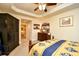Bedroom with tray ceiling, dresser, and access to the ensuite bathroom at 2180 Waterview Dr. # 1013, North Myrtle Beach, SC 29582