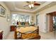 Bright bedroom featuring a tray ceiling, and a sunny window with a cozy bench at 2180 Waterview Dr. # 1013, North Myrtle Beach, SC 29582