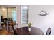 Dining area with modern decor, stylish built-in shelving, and sliding glass doors to outdoor space at 219 Birdie Way, Longs, SC 29568