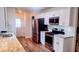 Modern kitchen featuring stainless steel appliances, white cabinets, granite countertops, and subway tile backsplash at 219 Birdie Way, Longs, SC 29568