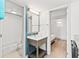 Clean bathroom featuring a vanity with sink, mirror and open access to shower and bedroom at 2311 S Ocean Blvd. # 341, Myrtle Beach, SC 29577