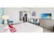 Comfortable bedroom featuring a kitchenette, a large television, and a queen sized bed at 2311 S Ocean Blvd. # 341, Myrtle Beach, SC 29577
