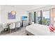 Bright bedroom featuring a dedicated workspace, an ocean view, and a queen sized bed at 2311 S Ocean Blvd. # 341, Myrtle Beach, SC 29577