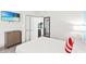 Comfortable bedroom with a flatscreen TV, dresser, and a glimpse into the kitchen at 2311 S Ocean Blvd. # 341, Myrtle Beach, SC 29577