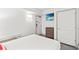 Simple bedroom with a TV, dresser, comfortable bed, and an access door at 2311 S Ocean Blvd. # 341, Myrtle Beach, SC 29577