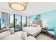 Cozy bedroom with ocean view balcony, contemporary decor, and a queen size bed at 2311 S Ocean Blvd. # 341, Myrtle Beach, SC 29577