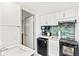 Practical kitchen with white cabinets, microwave, stove, and a mini fridge at 2311 S Ocean Blvd. # 341, Myrtle Beach, SC 29577