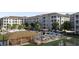 Resort-style pool area with tiki bar, dining seating, umbrellas, and lush landscaping at 235 Fins Up Circle # 1-102, Myrtle Beach, SC 29572