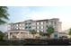 Charming multi-story building with beautiful landscaping and a 'Welcome to Paradise' entrance at 235 Fins Up Circle # 1-305, Myrtle Beach, SC 29572