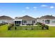 Aerial view of the fenced backyard with a patio and lush green lawn at 2438 Polaris Path, Myrtle Beach, SC 29577