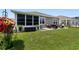 Backyard patio with outdoor dining, grilling area, and well-maintained lawn at 2438 Polaris Path, Myrtle Beach, SC 29577