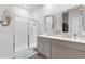 Bathroom with a glass-enclosed shower, double sink vanity, and mermaid decor at 2438 Polaris Path, Myrtle Beach, SC 29577