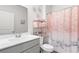 Bathroom featuring a single sink, marble countertop, and decorative shower curtain at 2438 Polaris Path, Myrtle Beach, SC 29577