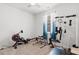 Bedroom features exercise equipment, natural light, and neutral walls for a relaxing experience at 2438 Polaris Path, Myrtle Beach, SC 29577