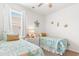 Bright bedroom with twin beds, colorful decor, and natural light at 2438 Polaris Path, Myrtle Beach, SC 29577