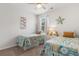 Bright bedroom with twin beds, nautical decor, and side table at 2438 Polaris Path, Myrtle Beach, SC 29577