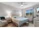 Cozy bedroom with a ceiling fan, comfortable bed, and bedside lamps at 2438 Polaris Path, Myrtle Beach, SC 29577