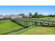 Charming wooden bridge over a creek, surrounded by lush greenery, in a serene community setting at 2438 Polaris Path, Myrtle Beach, SC 29577